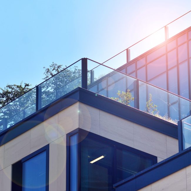 house-with-balcony-blue-sky-background